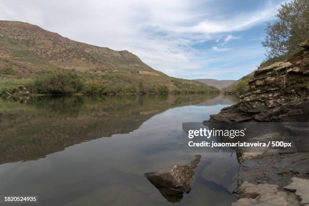 scenic view of lake and mountains against sky,spain - reflexo stock pictures, royalty-free photos & images