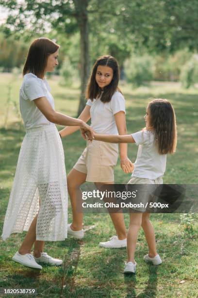 mother and daughters - peel park stock pictures, royalty-free photos & images