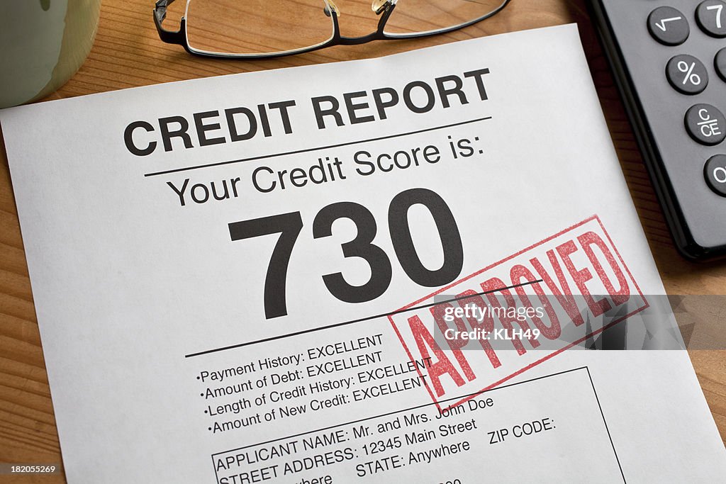 Approved Credit Score form on a desk.