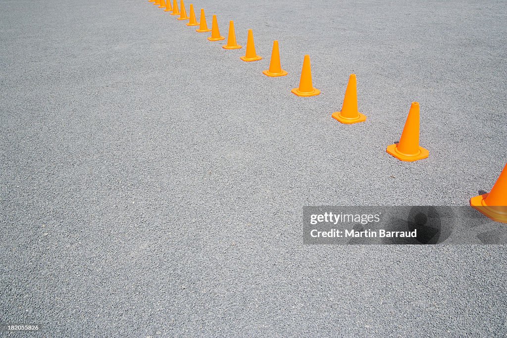 Traffic cones in line outdoors ground level view