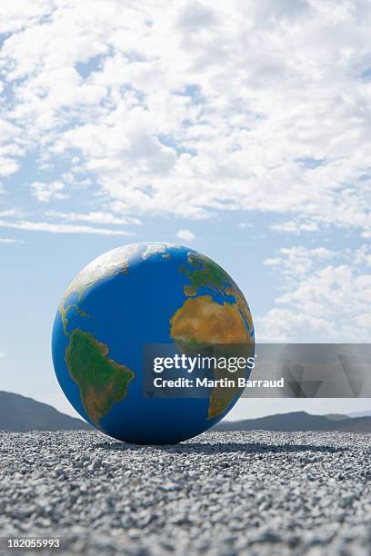 globe on gravel outdoors - desktop globe stock pictures, royalty-free photos & images