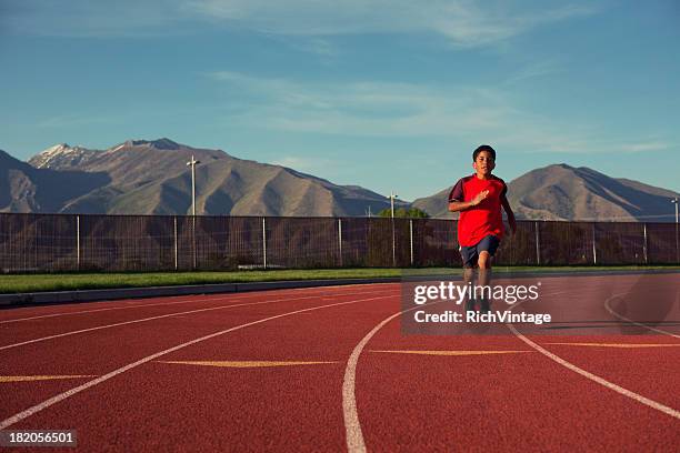 track practice - boy running track stock pictures, royalty-free photos & images