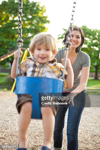 mutter und sohn - mother and son at playground stock-fotos und bilder