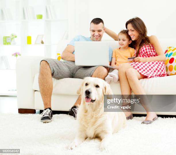 family shopping online with laptop. - person in front of computer stock pictures, royalty-free photos & images