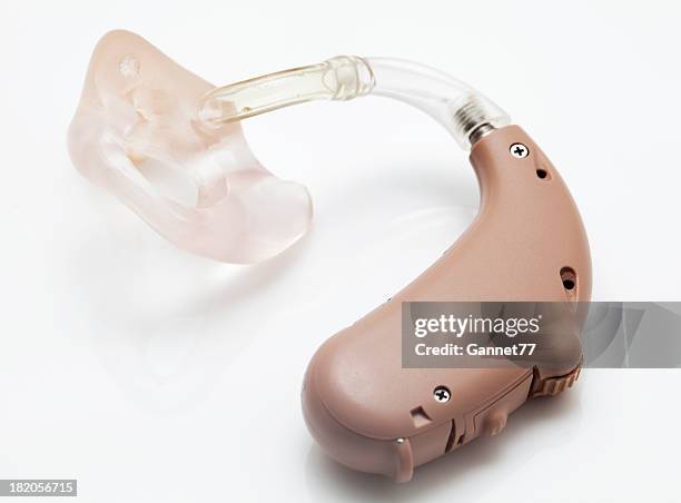 digital hearing aid - hearing aids stock pictures, royalty-free photos & images