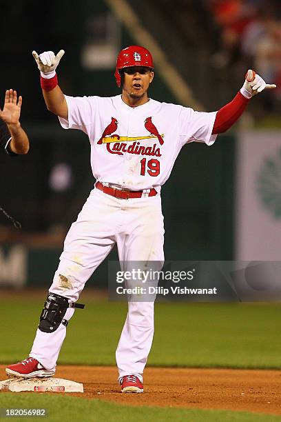 Jon Jay of the St. Louis Cardinals acknowledges his teammates after hitting a double against the Chicago Cubs in the fifth inning at Busch Stadium on...