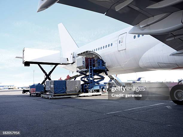 passenger plane - cargo container stock pictures, royalty-free photos & images