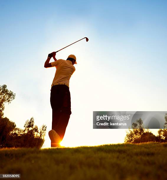golfer swinging at beautiful sunset - kentarus stock pictures, royalty-free photos & images