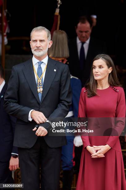 King Felipe VI of Spain and Queen Letizia of Spain watch a military parade after the solemn opening of the 15th legislature at the Spanish Parliament...
