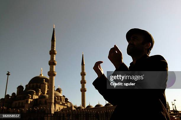 muslim man praying - muslim prayer stock pictures, royalty-free photos & images