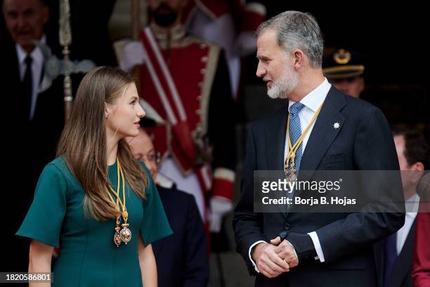 Crown Princess Leonor of Spain and King Felipe VI of Spain watch a military parade after the solemn opening of the 15th legislature at the Spanish...