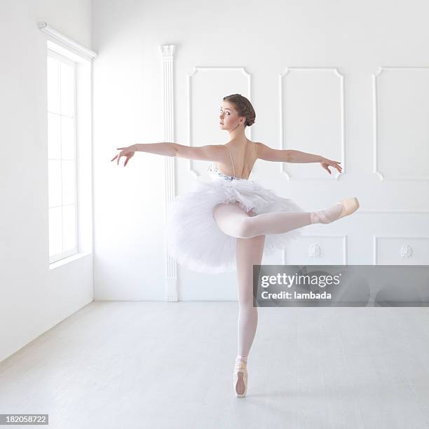 ballet dancer in white studio - ballet legs stock pictures, royalty-free photos & images