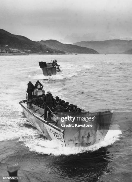 High-angle view of military personnel crowded into a landing craft during the landing exercises in preparation for the D-Day landings, off the coast...