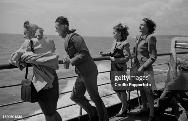 Passengers on the deck of the TSS Canterbury passenger ferry as it operates a cross channel service from the English port of Dover to Calais Harbour...