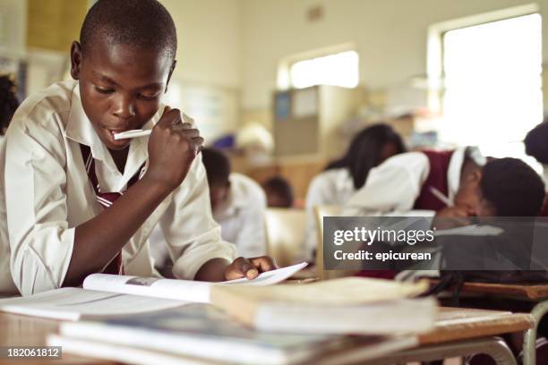 imagem de grande plano rapaz estudar áfrica do sul - marked sheet of paper imagens e fotografias de stock