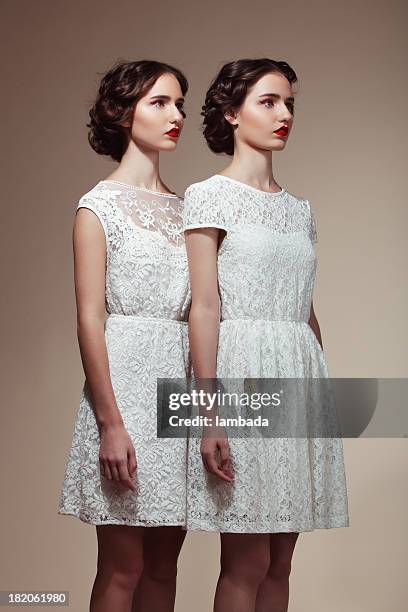 beautiful twins - girl white dress stock pictures, royalty-free photos & images