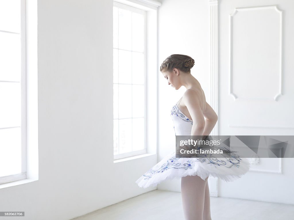 Ballet dancer in white studio