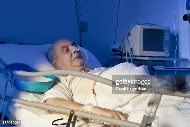 patient - adult male hospital bed stock pictures, royalty-free photos & images