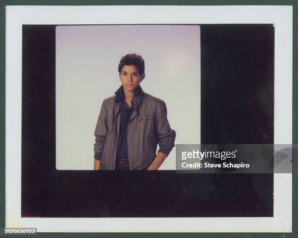 Portrait of American actor Ralph Macchio as he poses against a white background, Los Angeles, California, 1986.