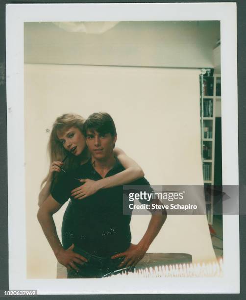 Portrait of American actors Rebecca DeMornay and Tom Cruise as they pose, against a white background, for the film 'Risky Business' , Los Angeles,...