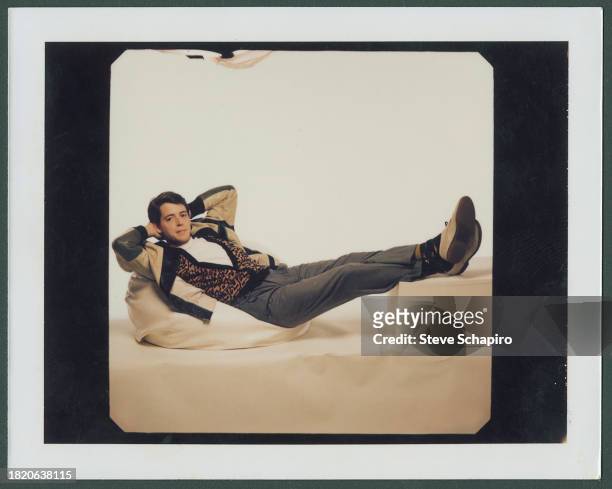 Portrait of American actor Matthew Broderick as he reclines against a white background for the film 'Ferris Bueller's Day Off' , Los Angeles,...