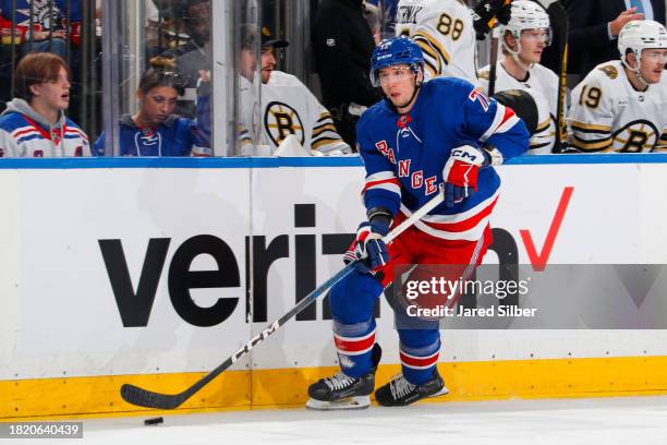 Tyler Pitlick of the New York Rangers skates with the puck against the Boston Bruins at Madison Square Garden on November 25, 2023 in New York City.