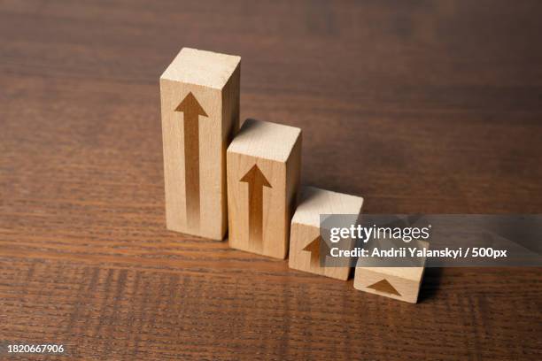 high angle view of wooden blocks on table - table font view stock pictures, royalty-free photos & images