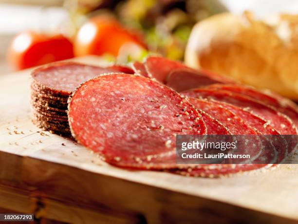 sliced peppered salami - salami stock pictures, royalty-free photos & images