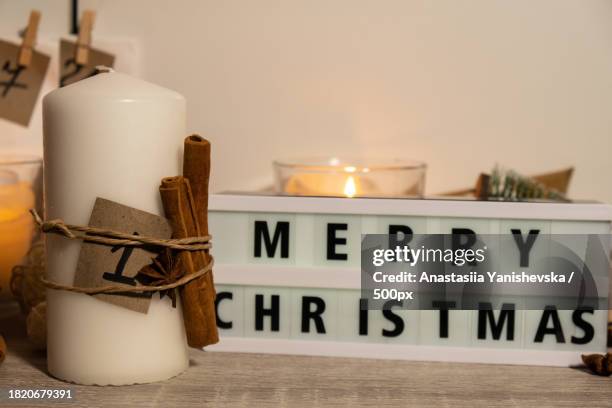 close-up of candle with text on table - real time stock pictures, royalty-free photos & images