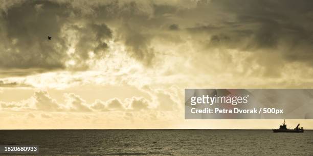 scenic view of sea against sky during sunset - farben stock pictures, royalty-free photos & images