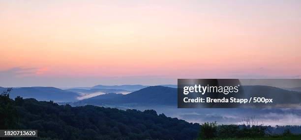 scenic view of silhouette of mountains against sky during sunset,montoursville,pennsylvania,united states,usa - pennsylvania stock pictures, royalty-free photos & images
