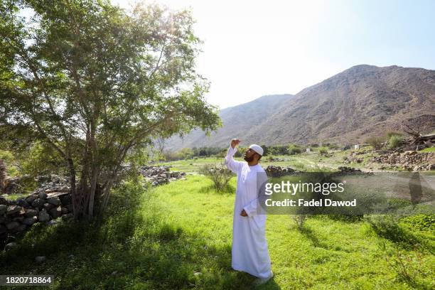 General scene of Fadl examining a Sidr tree on November 29, 2023 in Sharjah, United Arab Emirates. Fadel Al-Saadi, in his fifties, has been working...