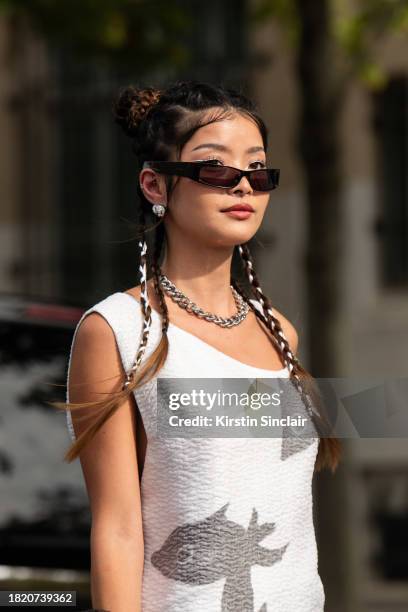 Caroline Hu wears all Givenchy outside the Givenchy show during the Womenswear Spring/Summer 2024 as part of Paris Fashion Week on September 28, 2023...