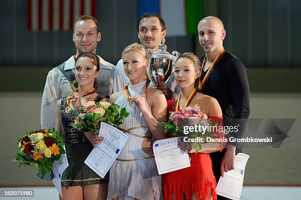 Pair skaters Tatiana Volosozhar and Maxim Trankov of Russia, Maylin and Daniel Wende of Germany and Mari Vartmann and Aaron van Cleave of Germany...