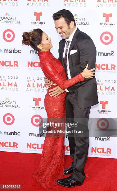 Eva Longoria and Ricardo Chavira arrive at the 2013 NCLR ALMA Awards held at Pasadena Civic Auditorium on September 27, 2013 in Pasadena, California.