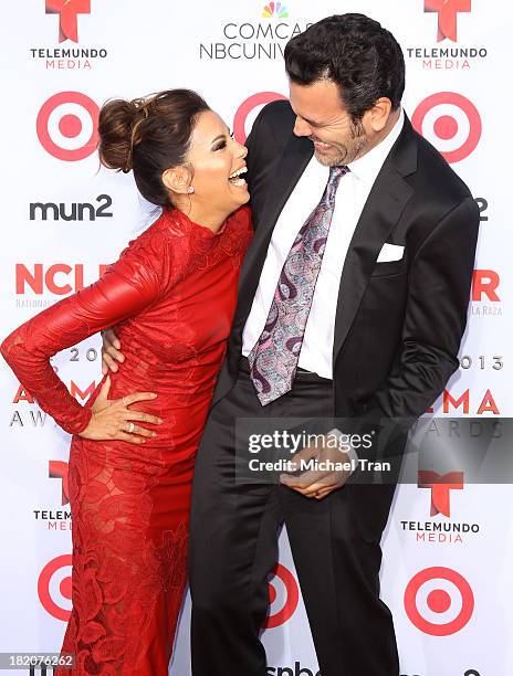 Eva Longoria and Ricardo Chavira arrive at the 2013 NCLR ALMA Awards held at Pasadena Civic Auditorium on September 27, 2013 in Pasadena, California.