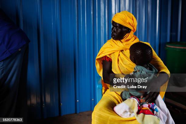 Young boy recovering from measles is bought into a clinic by his mother for MUAC measurements on November 29, 2023 in Rotriak, South Sudan. The young...