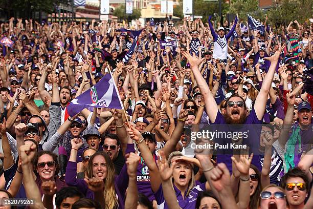 Dockers fans celebrate a goal during the 2013 AFL Grand Final between the Hawthorn Hawks and the Fremantle Dockers on South Terrace in Fremantle on...