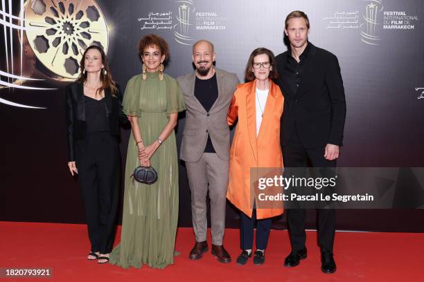 Members of the jury Camille Cottin, Leïla Slimani, Tarik Saleh, Joanna Hogg and Alexander Skarsgård attends the Homage to Faouzi Bensaïdi red carpet...