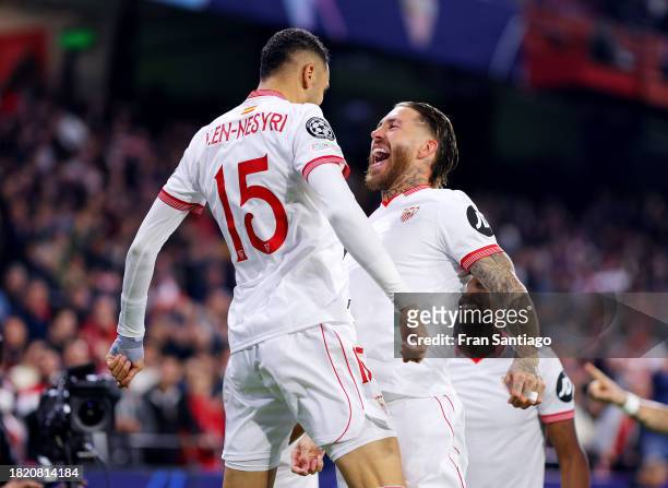 Yousseff En-Nesyri of Sevilla FC celebrates with teammate Sergio Ramos after scoring the team's second goal during the UEFA Champions League match...
