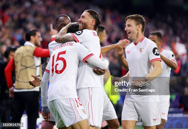 Yousseff En-Nesyri of Sevilla FC celebrates with Sergio Ramos and teammates after scoring the team's second goal during the UEFA Champions League...