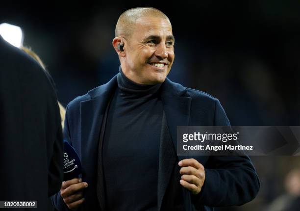 Former player Fabio Cannavaro reacts prior to the UEFA Champions League match between Real Madrid and SSC Napoli at Estadio Santiago Bernabeu on...