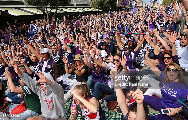 Dockers fans celebrate a goal during the 2013 AFL Grand Final between the Hawthorn Hawks and the Fremantle Dockers on South Terrace in Fremantle on...