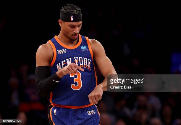 Josh Hart of the New York Knicks celebrates his three point shot against the Charlotte Hornets during the first half of an NBA In-Season Tournament...