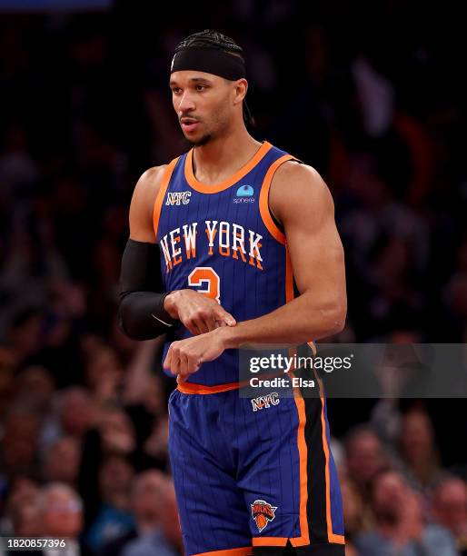 Josh Hart of the New York Knicks celebrates his three point shot against the Charlotte Hornets during the first half of an NBA In-Season Tournament...