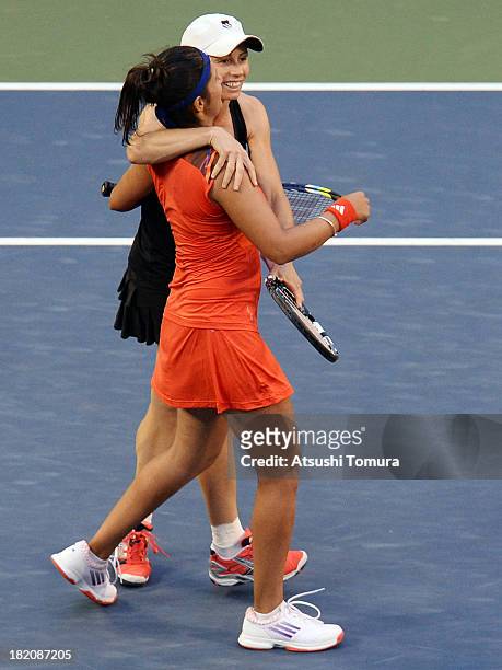 Cara Black of Zimbabwe and Sania Mirza of India celebrate after winning their women's doubles final match against Hao-Ching Chan of Chinese Taipei...
