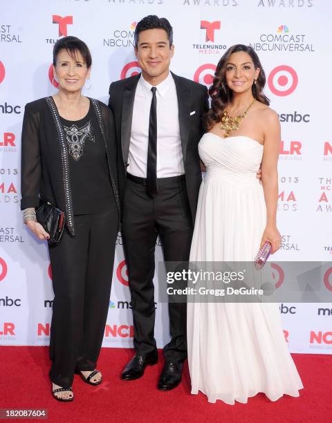 Actor Mario Lopez, mom Elvia Lopez and wife Courtney Mazza arrive at the 2013 NCLA ALMA Awards at Pasadena Civic Auditorium on September 27, 2013 in...