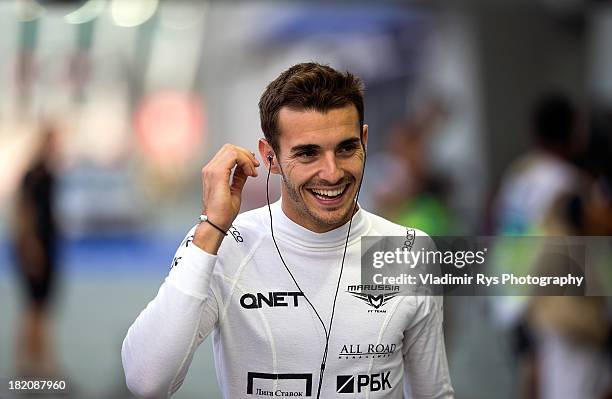 Jules Bianchi of France and Marussia smiles ahead of practice prior to qualifying for the Singapore Formula One Grand Prix at Marina Bay Street...