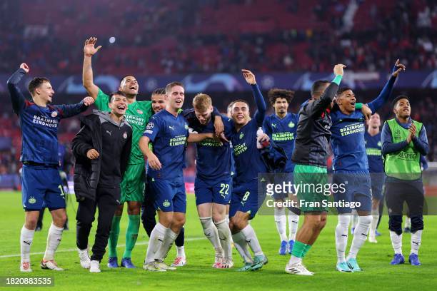 Players of PSV Eindhoven celebrate after the team's victory after the UEFA Champions League match between Sevilla FC and PSV Eindhoven at Estadio...