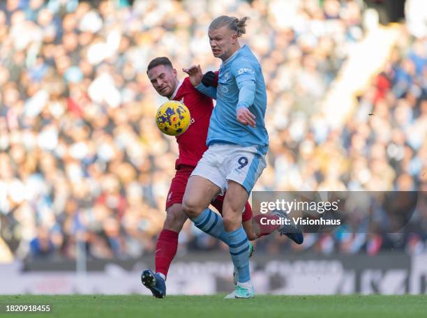 Erling Haaland of Manchester City and Alexis MacAllister of Liverpool in action during the Premier League match between Manchester City and Liverpool...